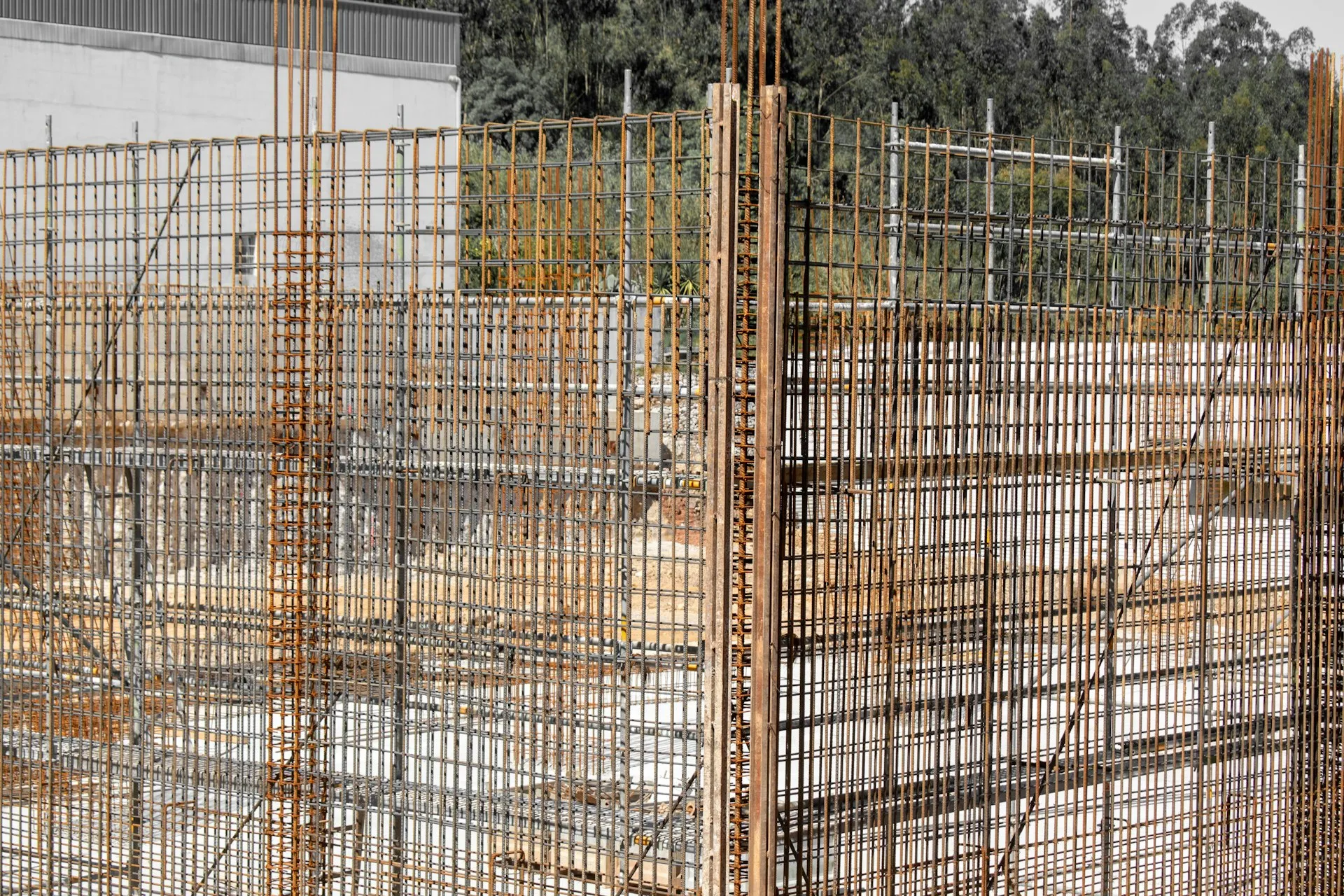 Steel reinforcement mesh cages standing ready before a concrete pour